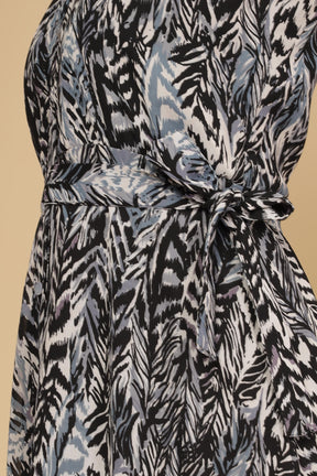 Black halter neck maxi dress with stylish leaf print design.