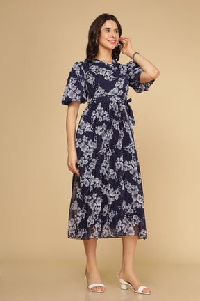 Navy floral pleated maxi dress model showcasing elegant summer style.