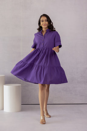 Stylish purple cotton midi dress with a tiered skirt and button details.