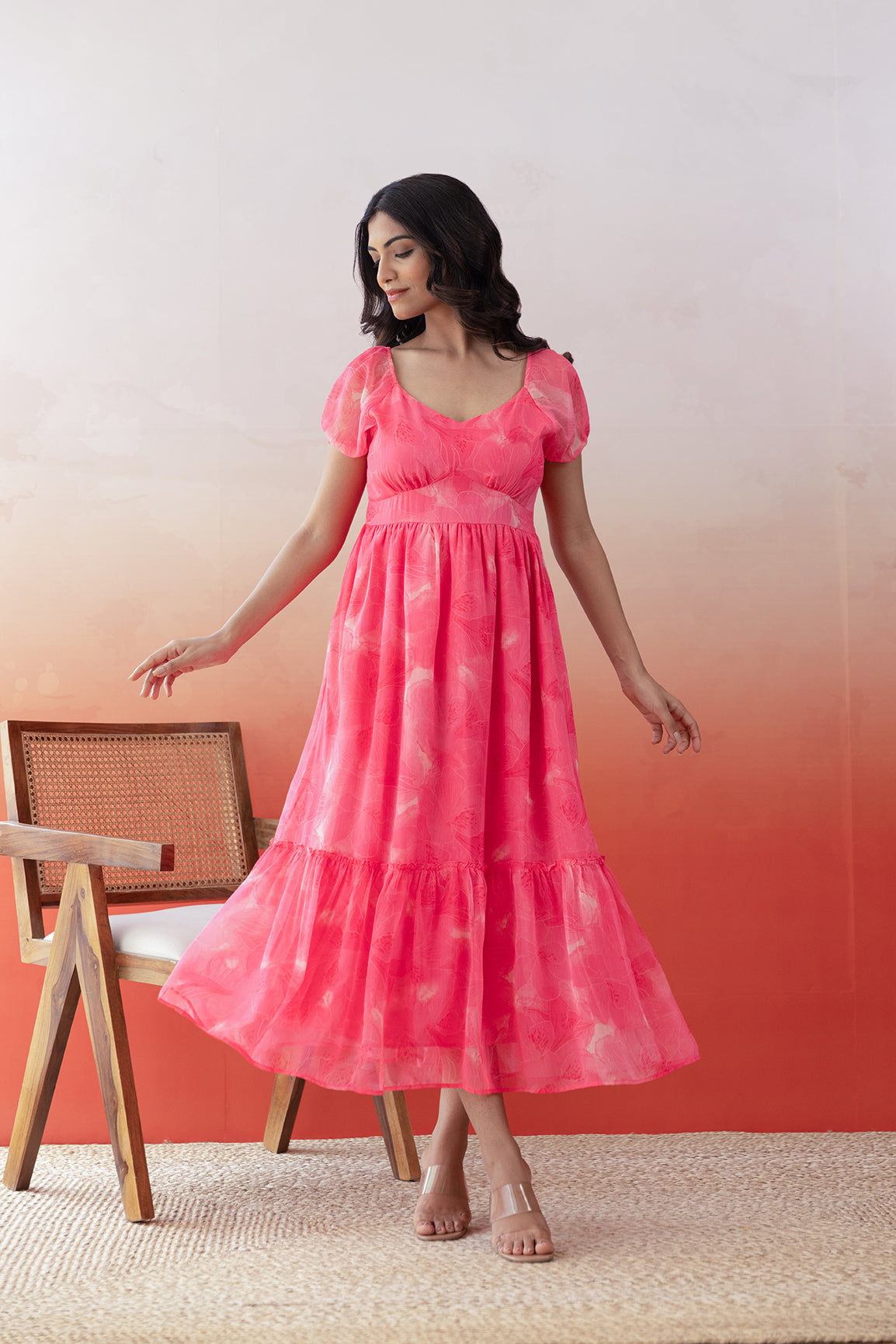 Elegant pink chiffon maxi dress for stylish summer occasions.