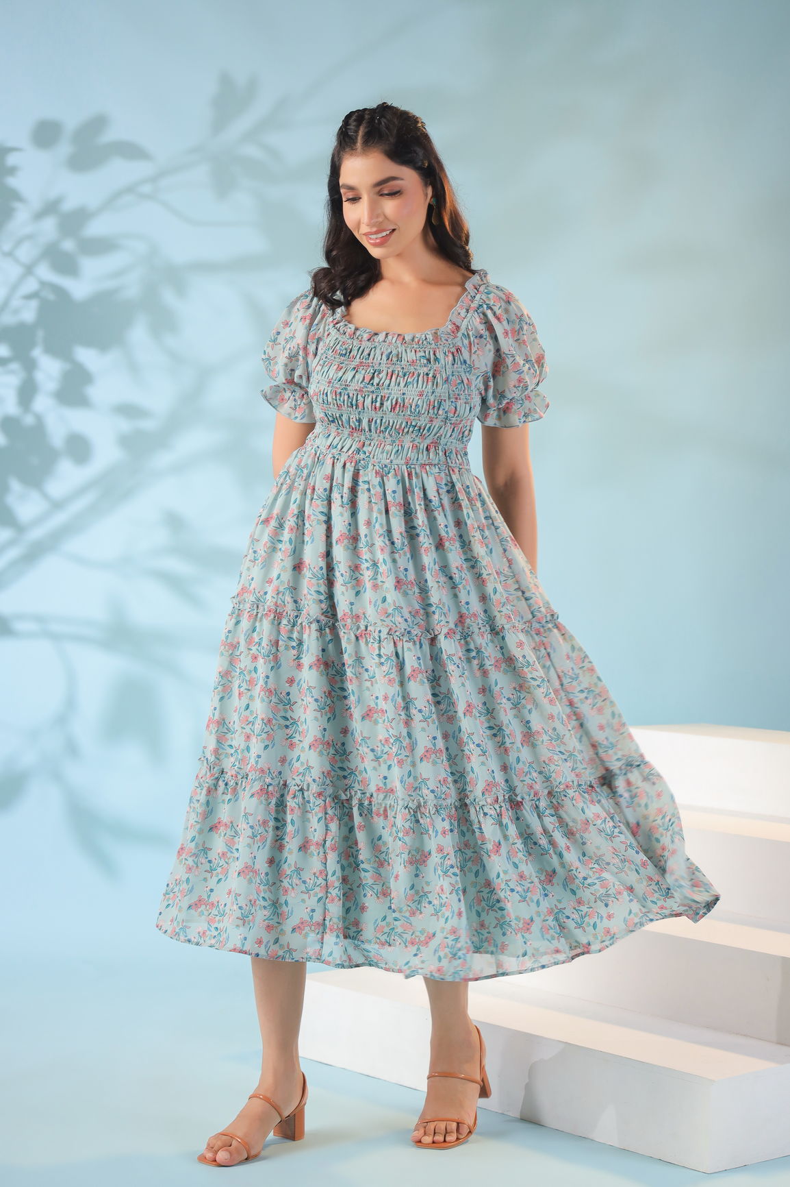 Pastel smocked nursing maxi dress with floral design and puff sleeves.