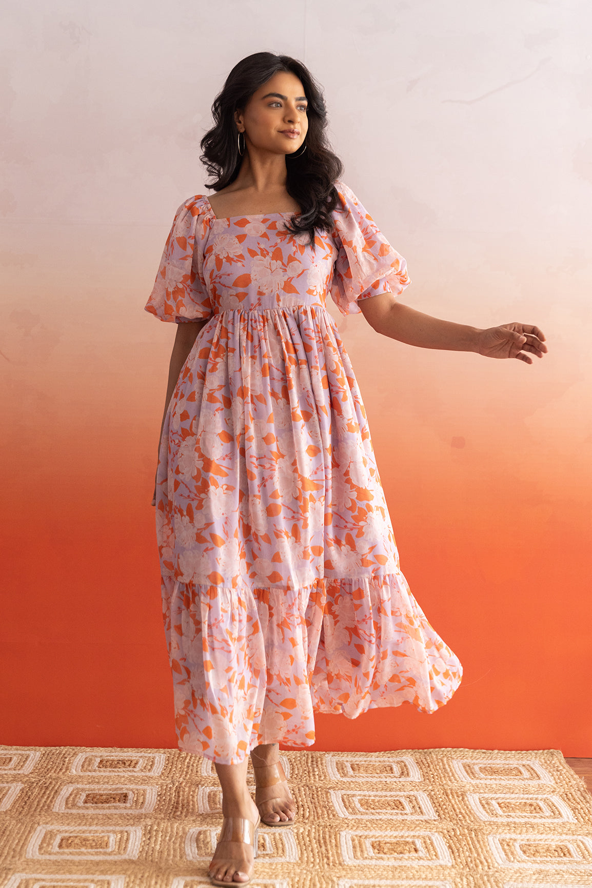 Pastel maxi dress with floral patterns, perfect for summer occasions.