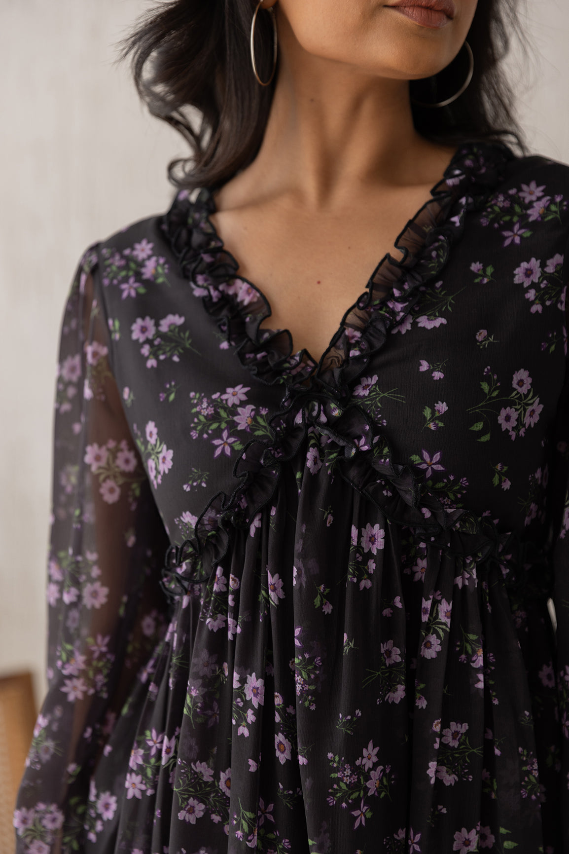 Black and lavender floral chiffon maxi dress with ruffled neckline.