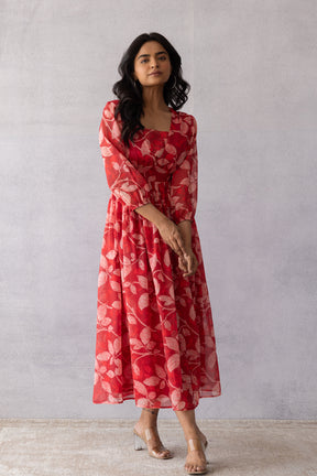 Dark red chiffon maxi dress with floral print, perfect for summer.