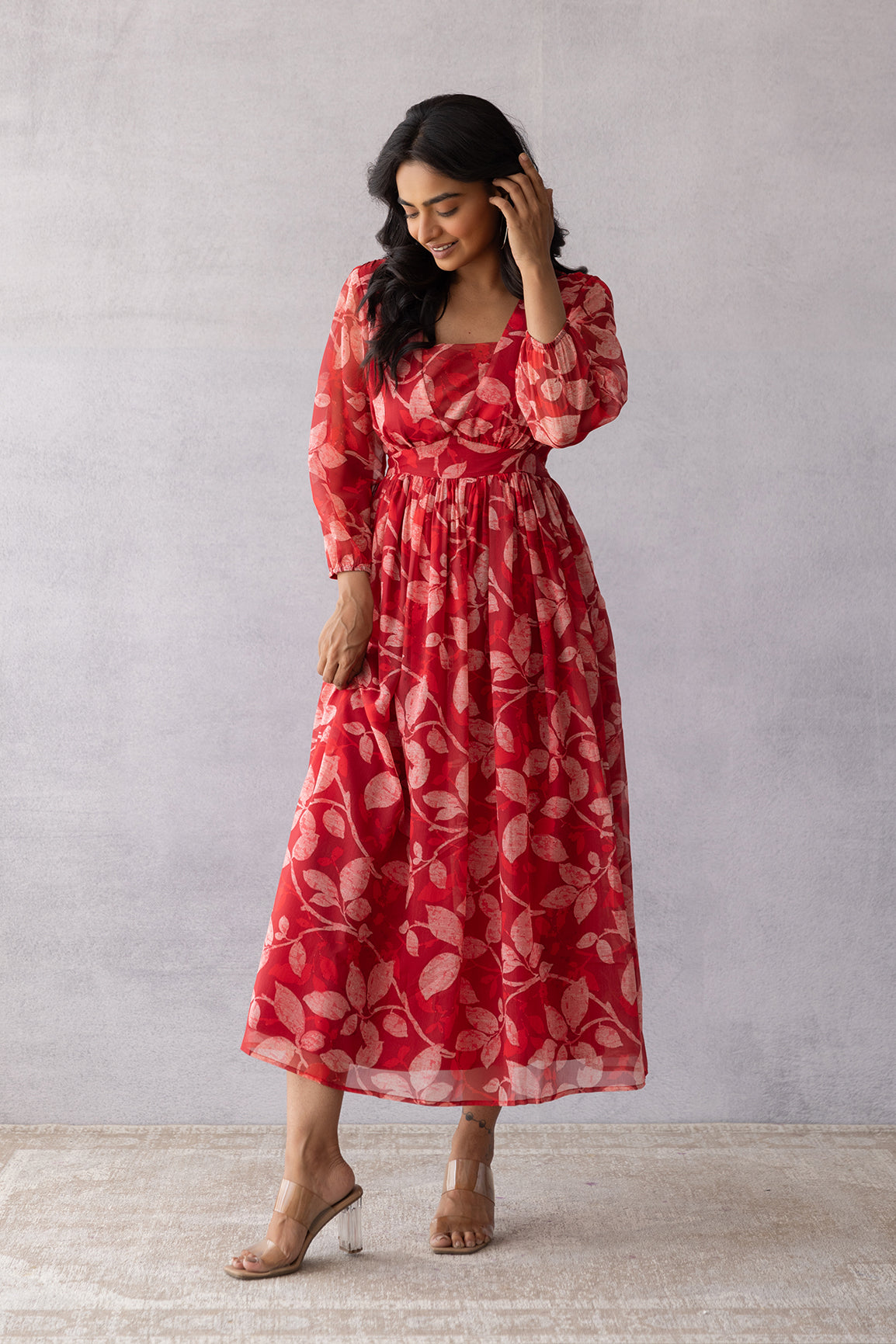 Dark red chiffon maxi dress with floral pattern and elegant design.