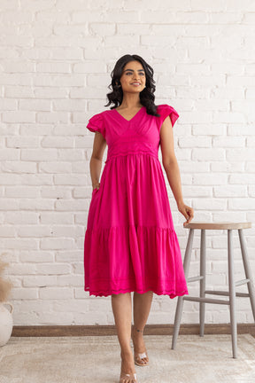 Stylish pink Schifilli cotton dress with short sleeves, perfect for summer.