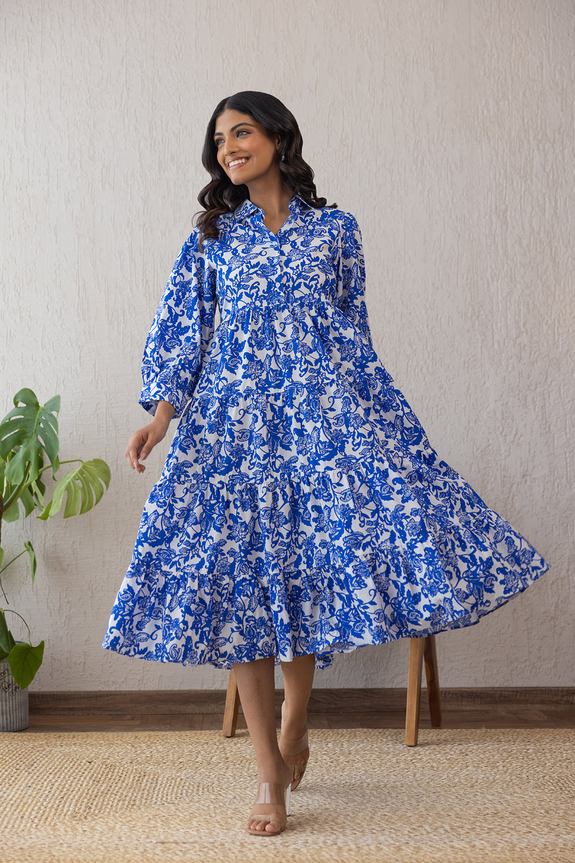 Model wearing a blue and white floral cotton maxi dress.