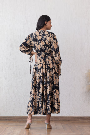 Elegant black and beige maxi dress with floral design, back view.