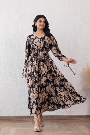 Elegant black and beige maxi dress with floral design.